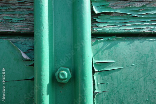 turquoise paint flaked of wood photo