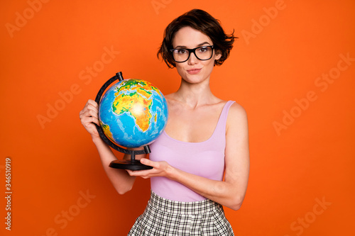Valokuva Portrait of confident smart positive girl hold globe ready answer geography ques