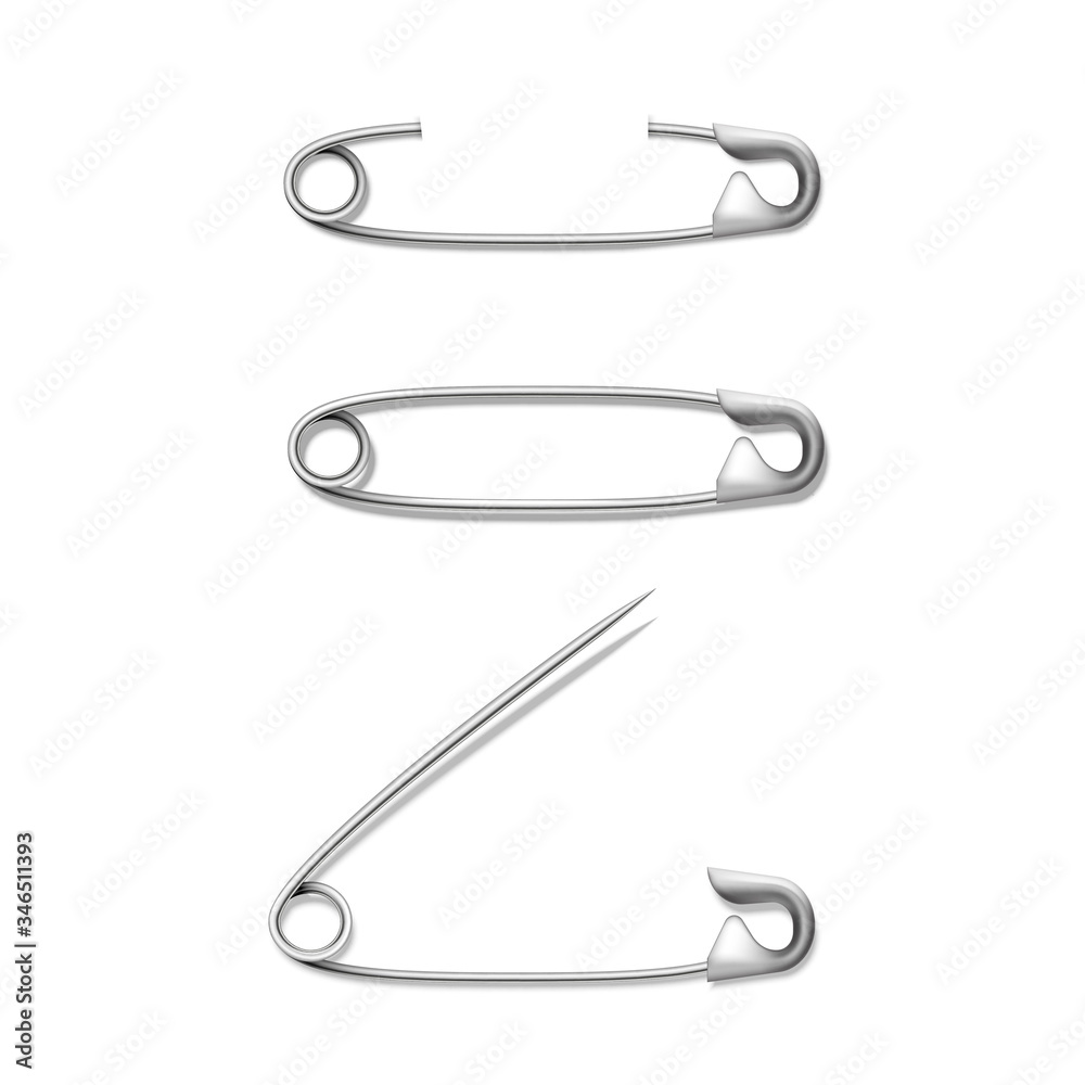 Set of attached to fabric, paper fastened, closed, opened silver or stainless steel safety pins. Set of attached to fabric, paper fastened, closed, opened silver or stainless steel safety pins.
