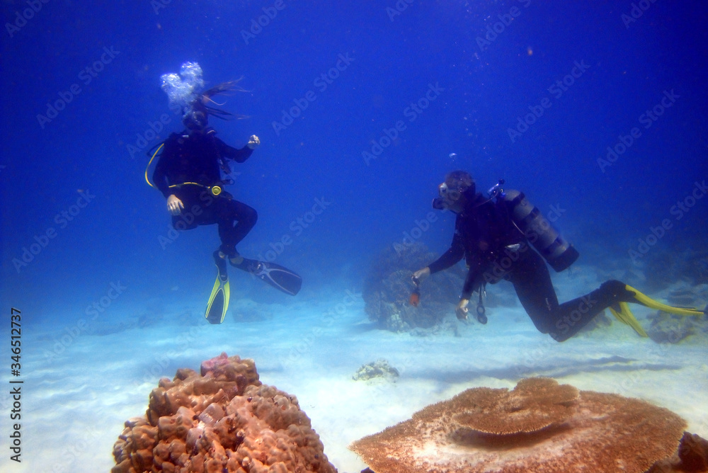 scuba divers underwater 