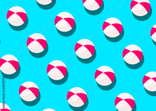 Striped ball pattern on blue background. Creative minimal composition, flat lay