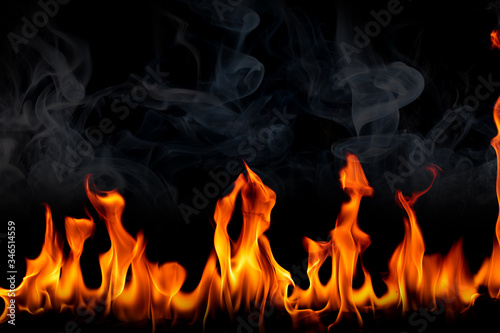 Fire flames with smoke on black background, Burning red hot sparks rise, Fiery orange glowing flying particles