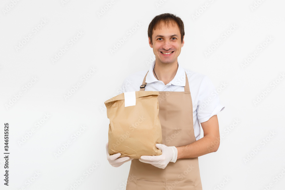 delivery man working in shirt with apron and protective gloves hand holding parcel isolated white background delivery man working in shirt with apron and protective gloves hand holding parcel isolated white background
