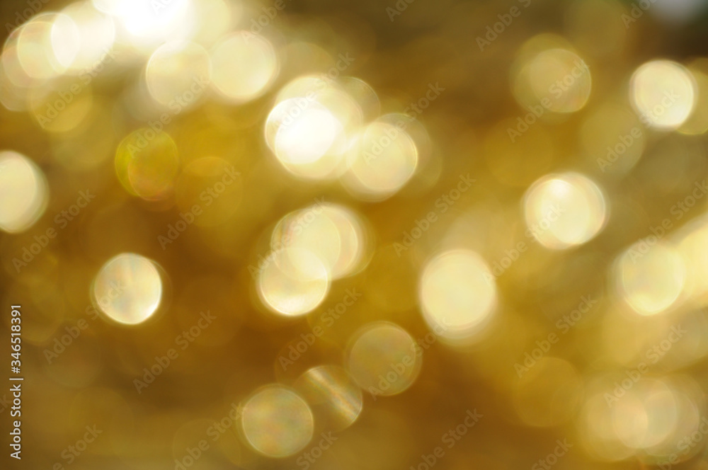 gold and yellow abstract bokeh lights. defocused background