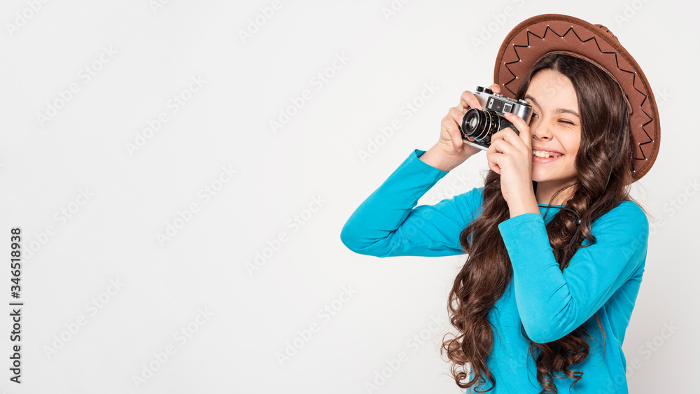 Naklejka premium Girl taking photos with copy space