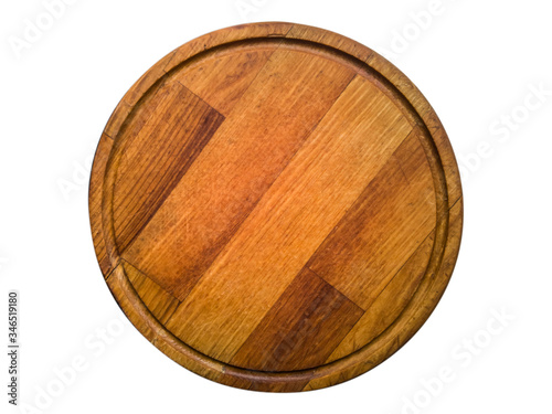 Round wooden kitchen board isolated on white.