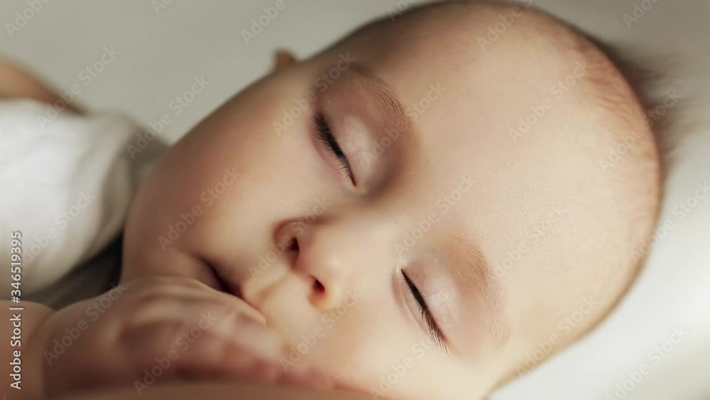 Close-up portrait of peaceful sleep baby boy in mother arms. Close-up portrait of peaceful sleep baby boy in mother arms.