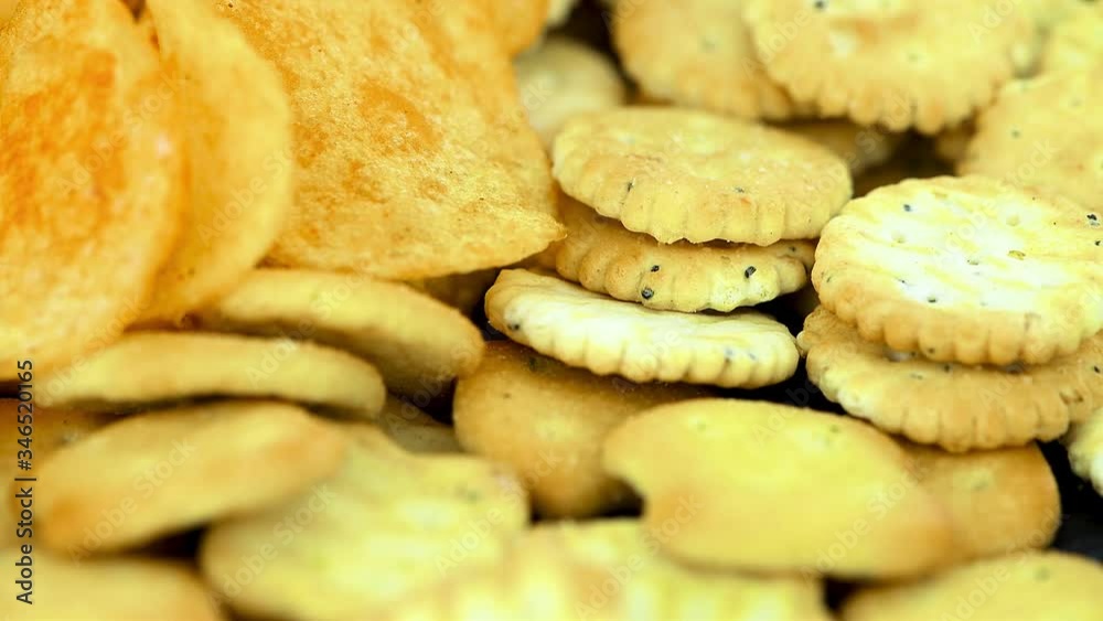 Mixed snacks on a rotating plate (seamless loopable) Mixed snacks on a rotating plate (seamless loopable)