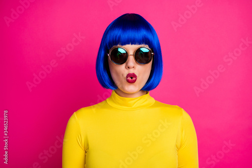 Closeup photo of cool trendy lady hold lips send kisses sexy chic wear stylish round retro specs yellow turtleneck blue short shiny wig isolated vibrant pink color background