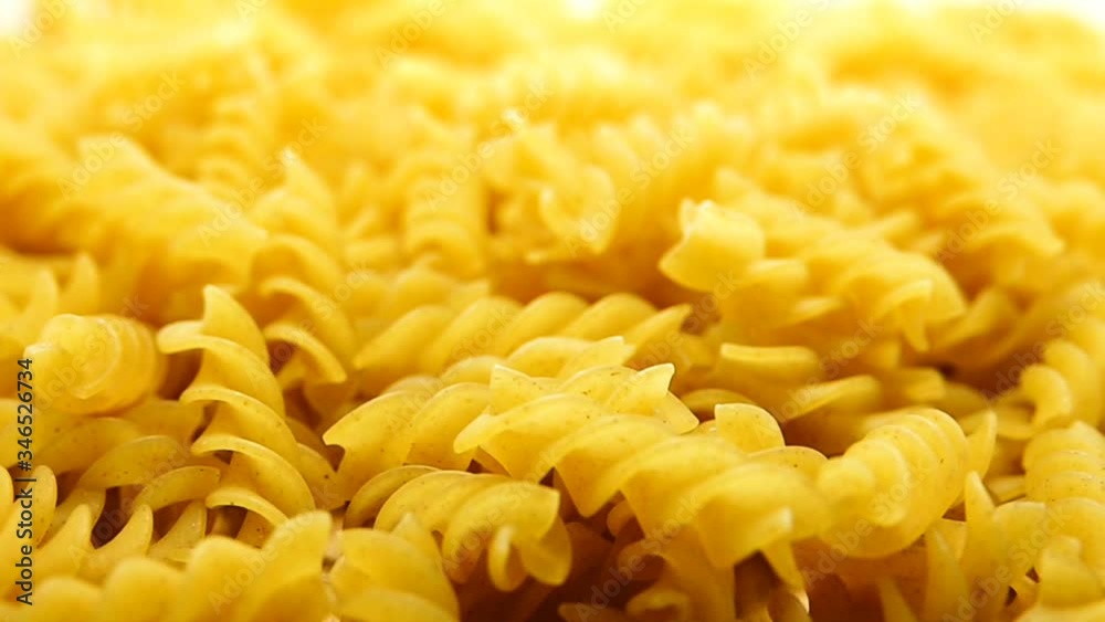 1080p HD super s;ow Uncooked pasta Rigatoni and Fusilli on food background. Cooking concept. Top view 1080p HD super s;ow Uncooked pasta Rigatoni and Fusilli on food background. Cooking concept. Top view