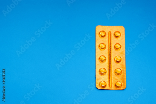 orange pack pill sealed on a blue background