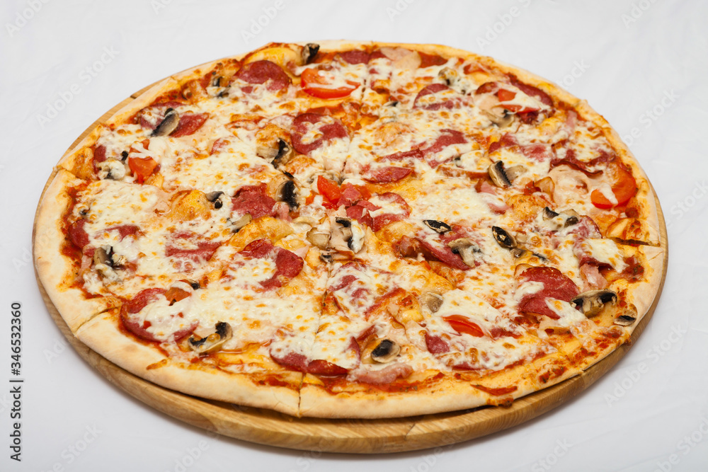 Pizza on a wooden board on a white background