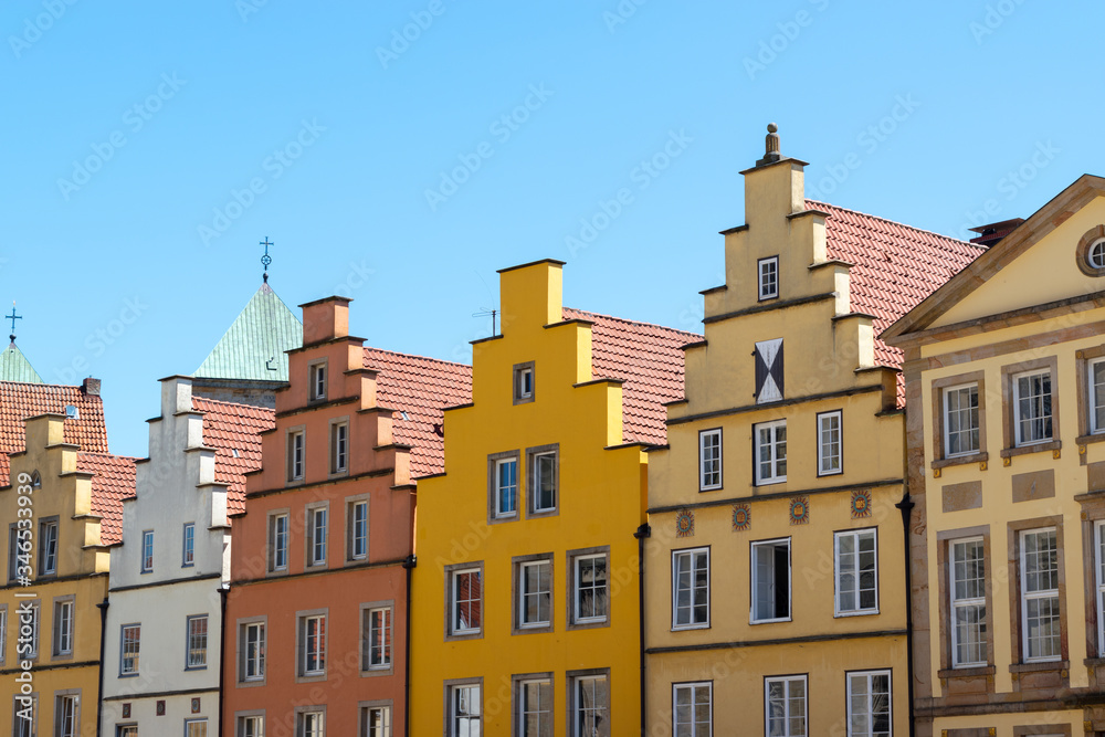 German travel brightly coloured houses against blue sky 