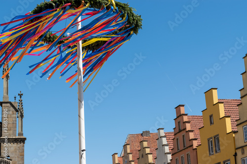 May Day maypole in German city with architecture in view religion and culture concept 