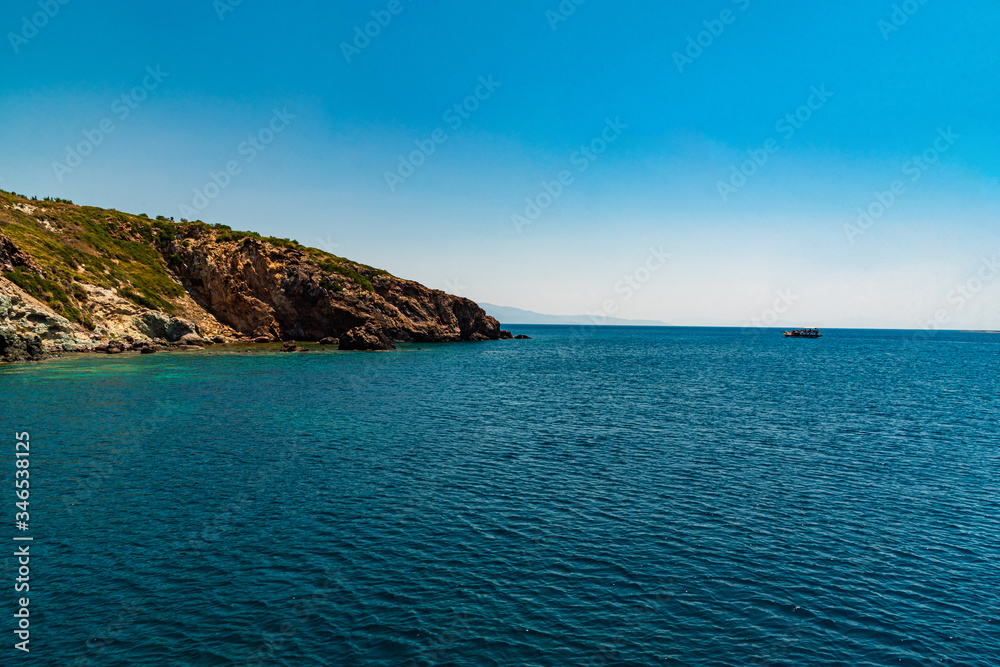 Naklejka premium View of the rocky shore from the ship
