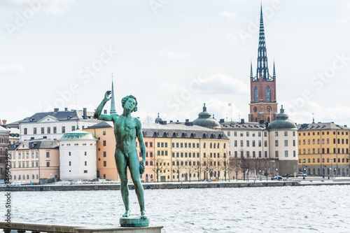 Statue of Carl Eldh Song in front of the town hall, historic centre Gamla Stan and Riddarholmen behind