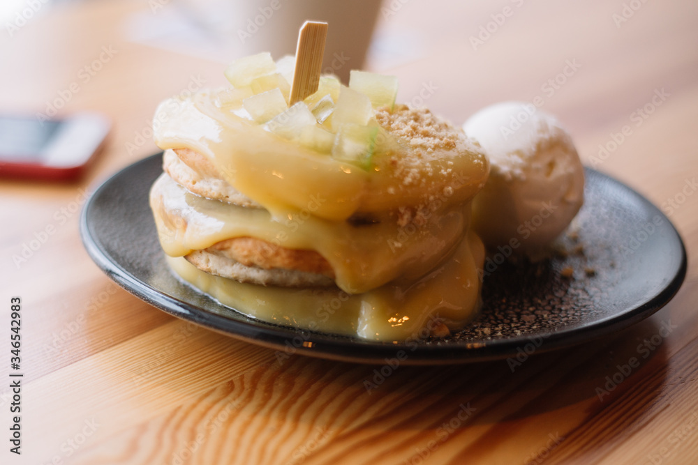 Delicious pancakes with ice cream for breakfast in a cozy cafe Delicious pancakes with ice cream for breakfast in a cozy cafe