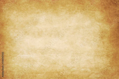 old dirty kraft paper texture or background with dark vignette borders