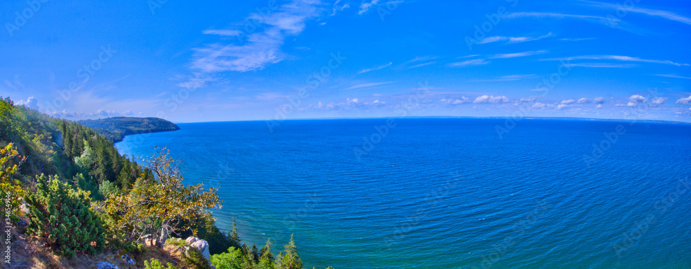 A panorama of the shoreline of lake Vättern by the Omberg park region