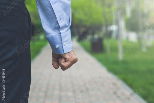 man fist on a green background