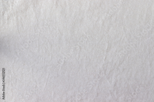 Natural cotton jersey fabric texture. Crumpled beige textile background