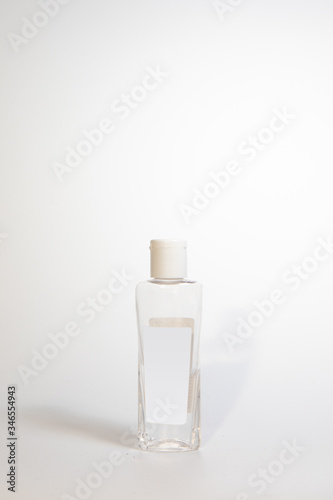 Fototapeta Naklejka Na Ścianę i Meble -  Alcohol Hand Sanitiser, Liquid Hand Wash Bottle Isolated on White Background, Coronavirus, Transparent Spray Bottle, Transparent Pump, Blue Liquid Disinfectant