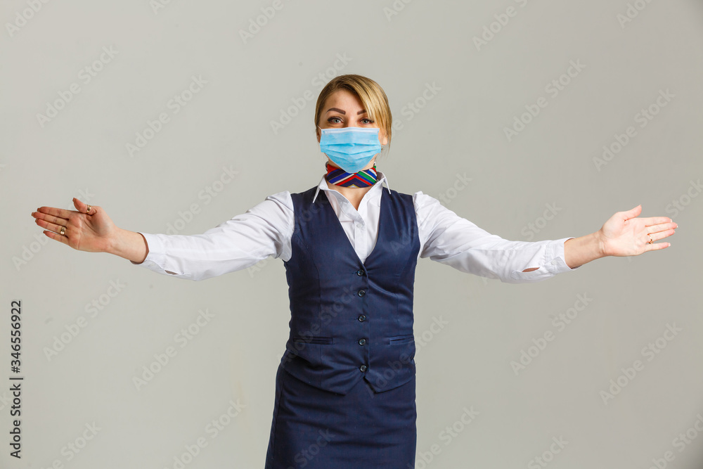 stewardess wearing protective medical mask. Concept virus protection coronavirus epidemic sars-cov-2 covid-19 2019-ncov. stewardess wearing protective medical mask. Concept virus protection coronavirus epidemic sars-cov-2 covid-19 2019-ncov.