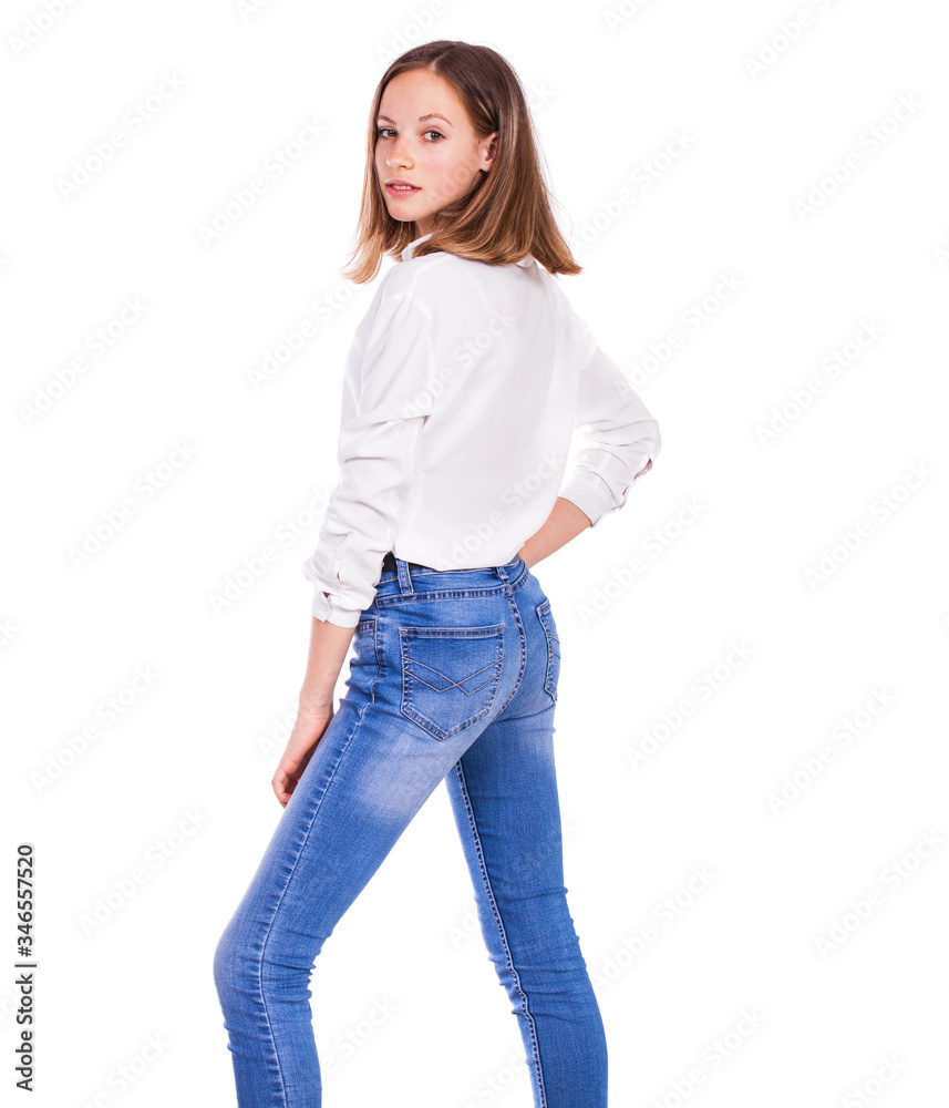 Portrait of a young beautiful blonde model in blue jeans and white shirt Portrait of a young beautiful blonde model in blue jeans and white shirt