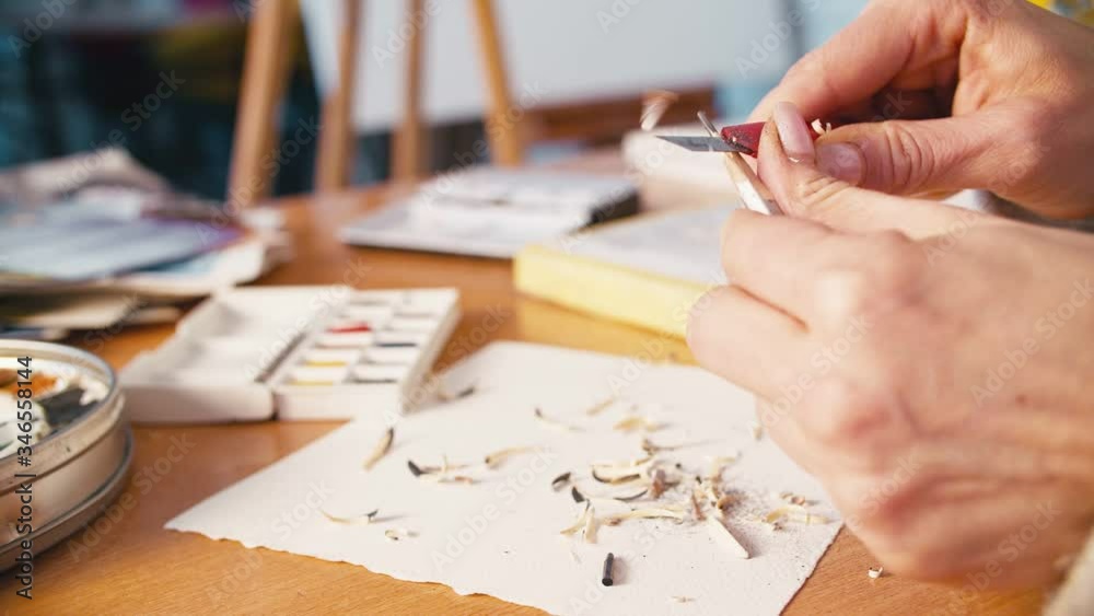 Art hobby. Creative occupation. Female hands sharpening pencil at workplace. Art hobby. Creative occupation. Female hands sharpening pencil at workplace.