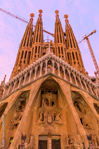 Sagrada Familia - A vertical wide-angle sunset view of the west Passion facade of The Basílica de la Sagrada Família. Barcelona, Catalonia, Spain.