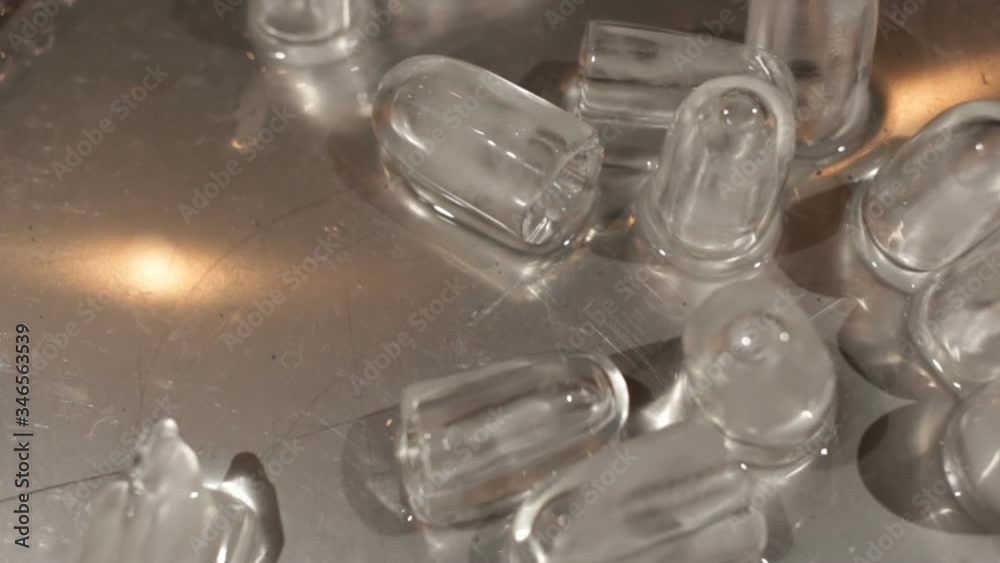 ice pieces in the form of a cylinder with a cavity inside on a screwdriver. A piece of ice falls down. Close-up, real time. ice pieces in the form of a cylinder with a cavity inside on a screwdriver. A piece of ice falls down. Close-up, real time.