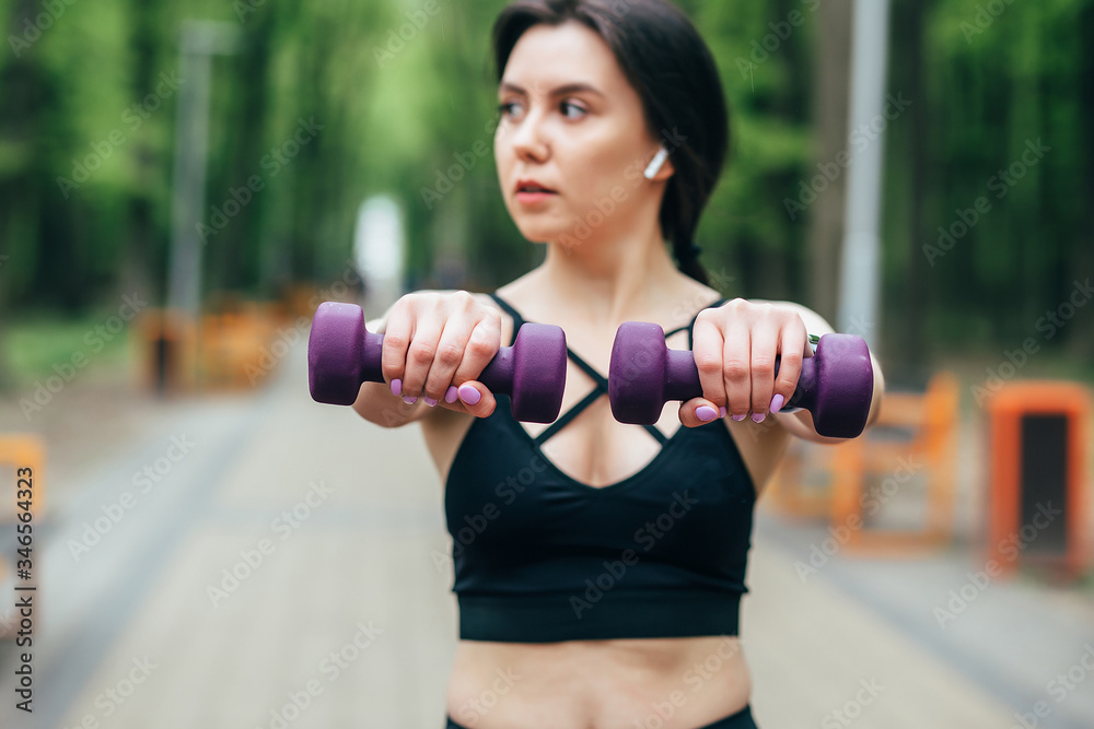 
beautiful girl on the street goes in for sports