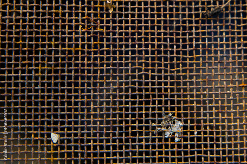 dark texture of rusty metal old dirty mesh