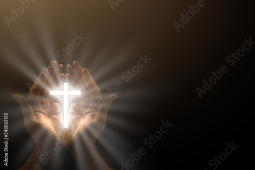 Obraz na plátne Man hands praying in dark background