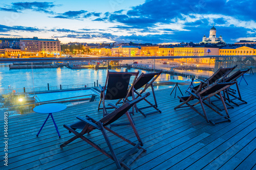 Evening in Helsinki. Finland. Recreation area in the Harbor of the Finnish capital. Street cafe with a view of the cruise port. Outdoor pools in Helsinki. Travel to Scandinavia.