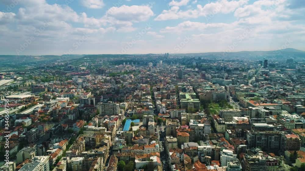 Aerial shot of Serbia capitol city - Belgrade on a bright summer day and sky full of white puffy clouds. Aerial shot of Serbia capitol city - Belgrade on a bright summer day and sky full of white puffy clouds.