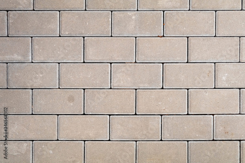 Obraz na płótnie Concrete rectangle paving slabs surface, top view texture of urban pattern w salonie