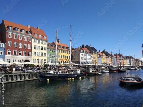 Copenhagen  Denmark. August 23  2017  Traditional Nyhavn houses in Copenhagen  Denmark. Along the canal there are many colored townhouses of the 17-18 centuries  bars  cafes and restaurants.