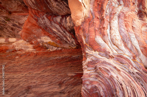 Coloured rock pattern detail of the Urn Tomb entrance, Royal Tombs of Petra, Jordan