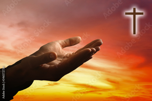 Hands of a man reaching to towards sky