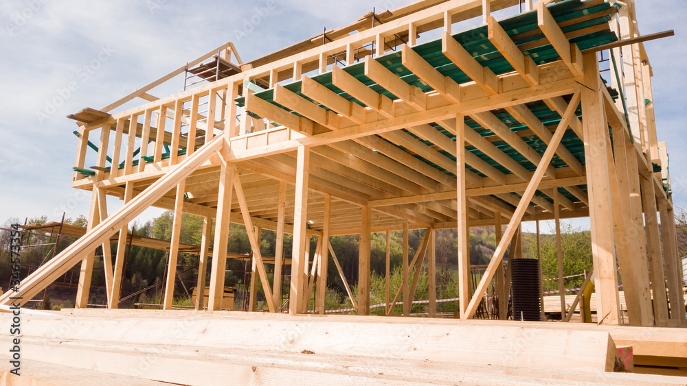 Framing of a new wooden house under construction Framing of a new wooden house under construction