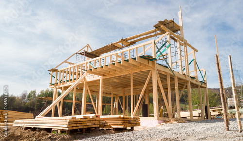 Framing of a new wooden house under construction © leszekglasner