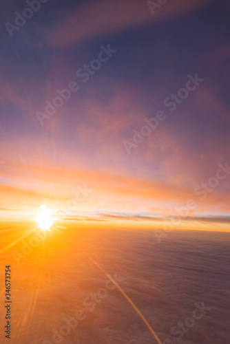 Fototapeta Naklejka Na Ścianę i Meble -  the sea of cloud sunset sky background from window airplane