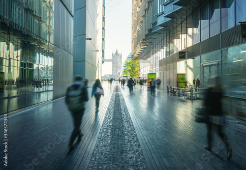 Φωτογραφία business people, modern buildings and Tower Bridge, London, UK