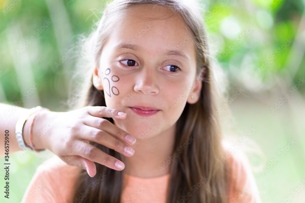 Beautiful Teen Getting her Face Painted, Makeup Beautiful Teen Getting her Face Painted, Makeup