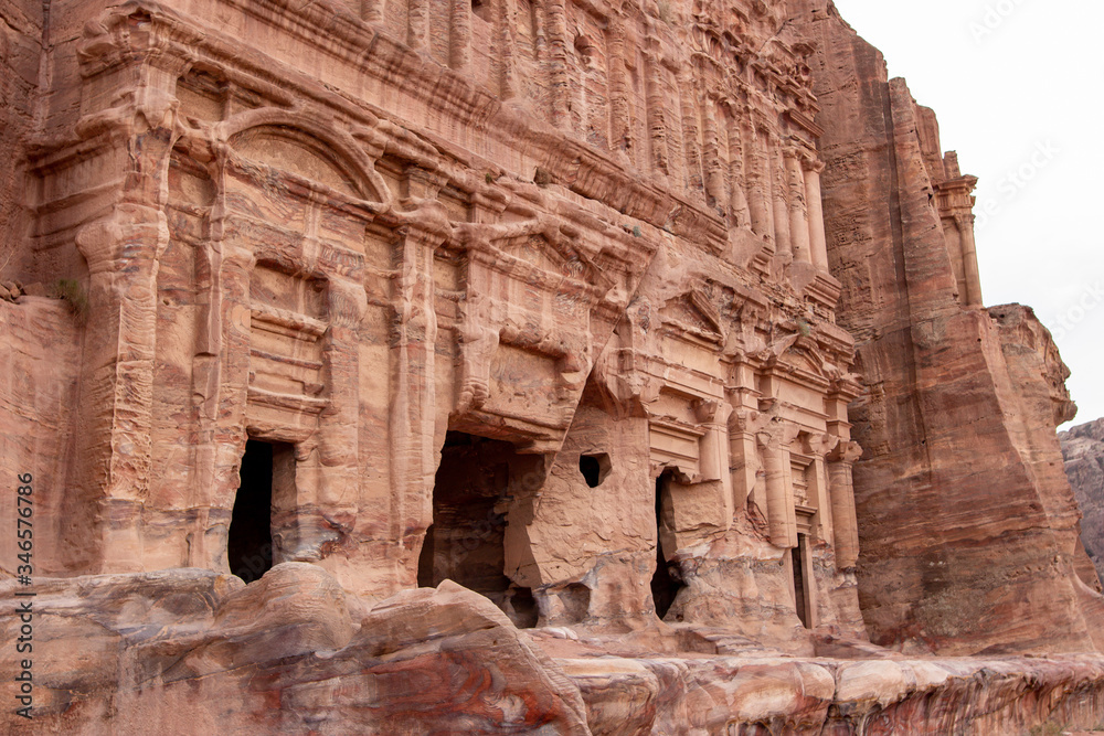 The rock-cut sandstone facade of the Palace Tomb in the ancient city of Petra, Jordan