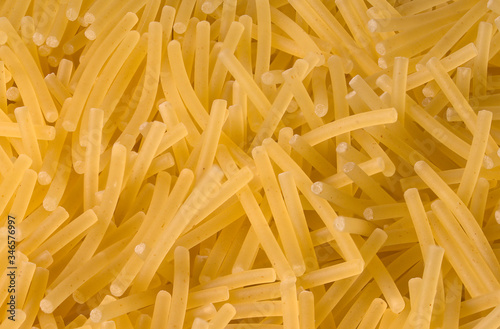 Yellow pasta "vermicelli" finely broken, close-up