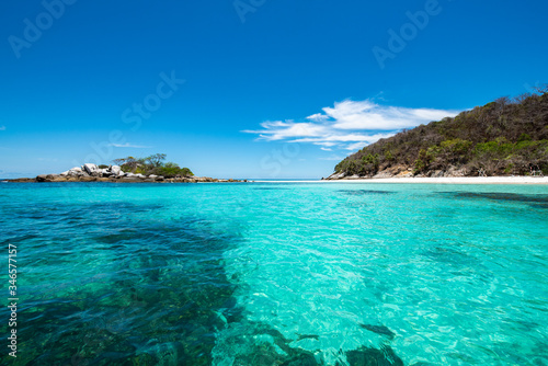 Racha Noi Island on a clear day with clear sea water during the high summer season,Phuket,Thailand. © satit