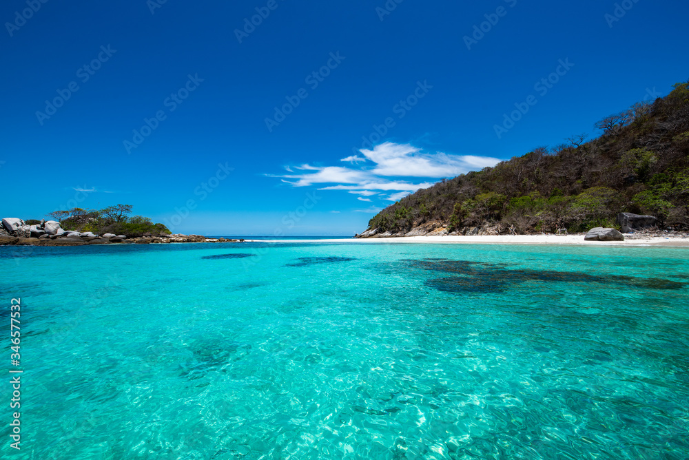 Racha Noi Island on a clear day with clear sea water during the high summer season,Phuket,Thailand.