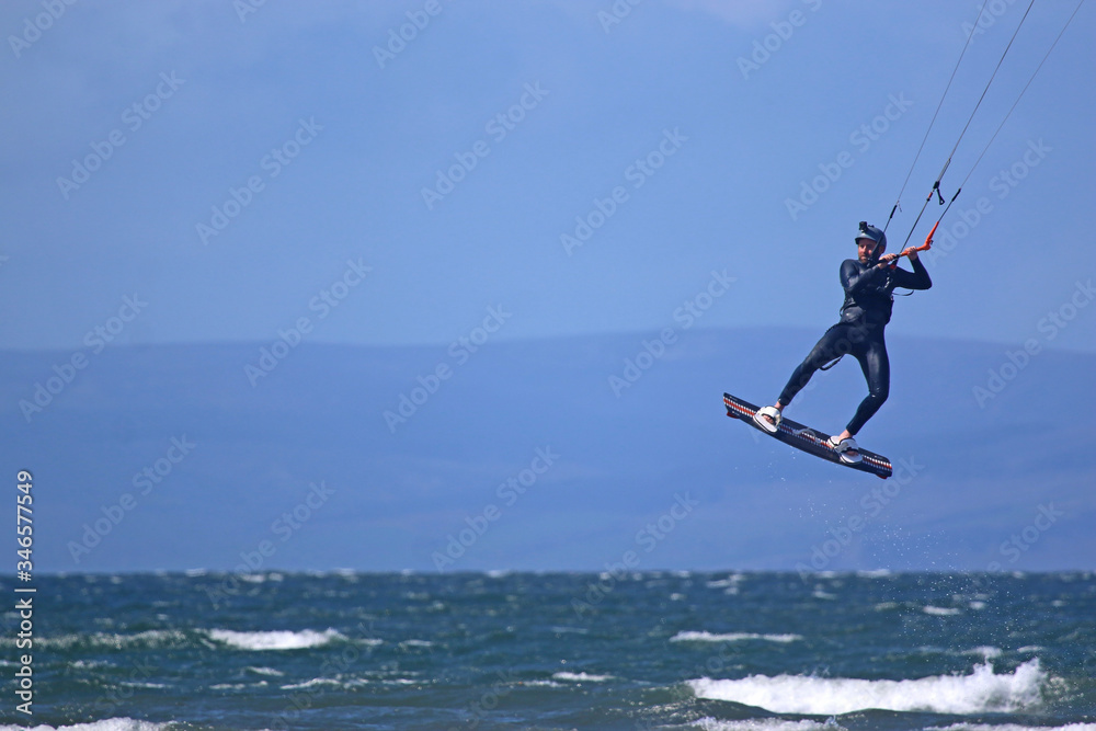 kitesurfer jumping at Troon, Scotland	